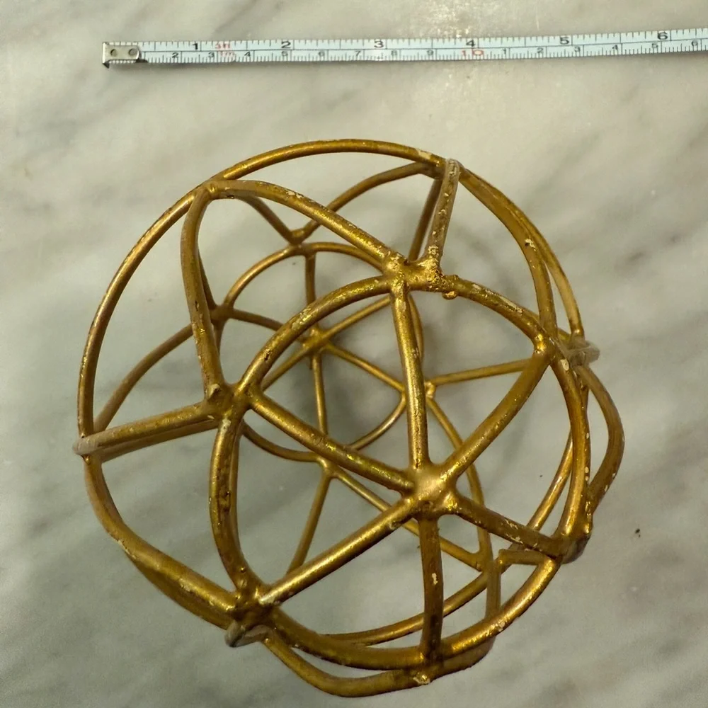 Gold round sculpture